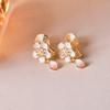 Aretes de camelia blanca perla de plata esterlina sin perforaciones nuevos de alta gama flores retro temperamento francés aretes de clip