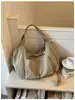Bolsa de Dumpling casual e descontraída estilo coreano para mulheres, bolsa transversal moderna, tecido de nylon de grande capacidade, bolsa de ombro elegante de alta aparência