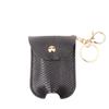 Fábrica eBay transfronterizo nuevo Pu imitación cuero portátil set de botellas de desinfectante de manos bolsa con borla colgante llavero colgante