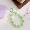 Corrente de celular colorida com contas foscas transfronteiriça, um acessório de nicho e de alta qualidade para bolsas, uma corrente estilosa para bolsas de mão e um pingente de conta para evitar perder seu celular