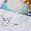 Cadena de tobillo con estrella de cinco puntas de plata con temperamento, cadena de tobillo de tubo redondo largo con estrella de cinco puntas sexy, cadena de pie con personalidad de nicho Joker al por mayor