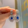 Nuevo conjunto de joyería de pendientes colgantes de lujo incrustados de diamantes azul zafiro retro estilo europeo y americano para mujer