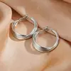 Pendientes metálicos de estilo retorcido con patrón irregular transfronterizo europeo y americano, pendientes de moda y exagerados, accesorios para orejas de mujer de lujo ligero y de alta gama