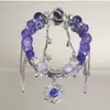 Pulsera de borla de planeta morado helado, diseño de nicho, alto atractivo estético, joyería hecha a mano con cuentas de estilo de hada, pulsera popular para mujeres