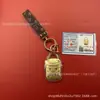 Garantizado para Hacerte Rico Caja de Regalo Llavero Colgante Bolsa Dorada Colgante Cadena de Teléfono Móvil Insignia Corporativa Personalizada Logo
