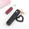 Llavero de Bolso para Labial Personalizado, Mini Neceser, Disponible en Varios Colores, Formas y con Logo, Espejo y Soporte para Teléfono