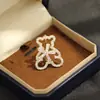 Nova Broche de Urso Vazado com Pedras de Diamante Fofo e Requintado com Design de Flor Rotativa, Alfinete de Animal, Acessório Unissex