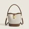 Bolsas de Verano Transfronterizas para Mujer 2026 Nuevo Estilo Coreano de Moda Bolsos Texturizados Bolsos Cubo Bolsos de Lona Bolsos Cruzados Fabricante