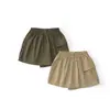 Diretamente da fábrica: Saia curta 2026 para meninas, saia curta infantil estilo workwear com bolsos, saia casual da moda primavera/verão MDD