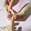 Palo para presionar uñas de doble punta disponible palo para limpiar uñas picadiente de plástico palo empujador de pegatinas de uñas empujador de piel muerta de plástico