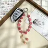 Nuevo Cordón para Teléfono Rosa de Estilo Chino con Flor Tallada y Colgante de Gato Bodhi, Correa Corta Anti-Pérdida para Teléfono al por Mayor