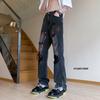 Vaqueros micro rotos con grafiti teñido anudado, pantalones de hip hop callejeros americanos, pantalones rectos de calle alta europeos y americanos de moda.