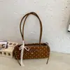 Bolso diario simple y elegante de lunares, nuevo modelo de verano 2026 para mujer, de nicho y súper popular, versátil estilo coreano y japonés para hombro, mano y axila