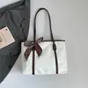 Bolsa de Hombro Casual Simple Estilo Nuevo Primavera 2026 Bolsa Tote de Aspecto Elegante para Estudiantes Universitarias Bolsita Sencilla para Clase para Mujeres