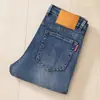 Marca de moda de Hong Kong para hombre, corte recto ajustado, de alta gama, lujo, moda informal de negocios, versátiles, jeans elásticos