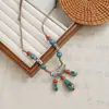 Collar más vendido del Libro Rojo Colección Nuevo Estilo Étnico Chino Cerámica Cadena Larga de Lana para Mujer Accesorios Colgantes Antiguos Mujer