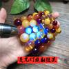 Segunda generación Duobao ámbar cera de abeja flotante fluorescente cuentas redondas amarillo aceite de pollo ámbar sangre ámbar azul pulsera de estilo étnico para hombres y mujeres