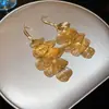 Brincos de Metal com Franjas de Pétalas Vazadas Europeus e Americanos Leve Luxo Gancho de Orelha de Alta Qualidade Brincos de Moda Retrô Senso de Design Nicho