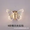 Lámpara de pared de mariposa, lámpara de mesita de noche de lujo ligero nórdico para dormitorio, cálida y romántica, luz decorativa de fondo de estilo diseñador moderno para pasillo