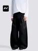 Con una rica hoja occidental curva simple retro americana para hombres y mujeres pantalones de pierna ancha diseño de pliegues holgados sentido de diseño corte tridimensional