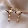 Pendientes de borla de mariposa súper llamativos de alta gama franceses, estilo femenino, ligeros y lujosos, accesorios de moda para las orejas.