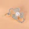 Broche de aleación de moda coreana al por mayor sentido de alta gama nicho accesorios de corsage de perlas hebilla de pin para cuello de mujer que combina con todo