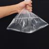 Bolsa de Embalaje Grande Personalizada a Prueba de Humedad Bolsa de Plástico Transparente Engrosada Película Interna Bolsa de Plástico Película Bolsa Alta Presión Pe Solapa Plana Bolsillo Pantalones