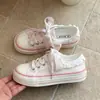 Zapatos blancos estilo hada para mujer, nuevos zapatos casuales bajos de lona con cordones y ribete de encaje, primavera-verano 2026, zapatos de lona de nicho para mujer