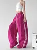 Pantalones anchos de retazos a rayas casuales estilo americano para mujer, nuevo modelo primavera 2026, pantalones deportivos casuales de corte holgado para bailar y street dance, modernos
