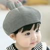 Versión coreana de gorra de protección para las orejas de conejo de dibujos animados al por mayor otoño e invierno nuevo para niños y niñas orejas largas gorra fina de terciopelo 2098