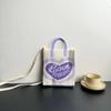 Nova Bolsa de Malha de Grande Capacidade Advanced Sense Ins Bolsa para Celular Nicho Ombro Crossbody Bolsa Cartoon Fashion Bolsa