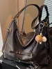 Bolsa de ombro única de cor sólida com nova textura transfronteiriça, bolsa de axila, mochila de grande capacidade moderna, bolsa tote alta e estilosa