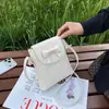 Bolsa de celular com padrão trançado 2026 para mulheres, nova mini bolsa simples e versátil, bolsa de ombro transversal moderna e leve