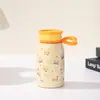 Taza de leche mini de vacío de dibujos animados para estudiantes, taza termo portátil y compacta de bolsillo para uso en exteriores, vaso de agua práctico para coche al por mayor