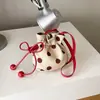 Bolso de lona de lunares de moda para mujer, nuevo modelo 2026, bolso de cordón texturizado de moda japonesa y coreana, bolso cruzado versátil de moda