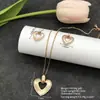 Conjunto de pendientes y collar Xuping estilo vintage de nicho europeo y americano transfronterizo, conjunto de joyería elegante de aleación de cobre, venta al por mayor y hecho a medida