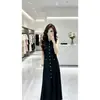Ropa de mujer de comercio exterior, elegante estilo francés, femenina, suave, sin mangas, tejida, vestido largo, nuevo modelo de verano, de un solo pecho, negro con diseño calado