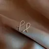 Pendientes Exquisitos de Línea Entrelazada, Versátiles y Elegantes, Pendientes de Alta Gama de Celebridad de Internet Coreana, Pendientes de Diseño de Nicho para Mujer al por Mayor