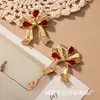 Diseño de lazo aretes geométricos lindos para mujer tendencia dulce europea y americana moda incrustación temperamento aretes retro moda