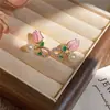 Aretes de perla con flor de gota de aceite de aguja de plata, frescos, dulces, simples, versátiles, de nicho, de alta gama, modernos para mujer