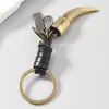 Chaveiro de couro bovino com dentes de cobre estilo europeu e americano vintage com pingente de totem étnico, acessório para bolsa, presente transfronteiriço da Amazon