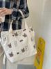Bolso de hombro de lona de gran capacidad y combinable para estudiantes, bolso de compras portátil, bonito bolso con diseño de oso AB, venta al por mayor