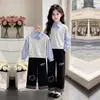 2026 Novo Conjunto de Duas Peças para Primavera e Outono Estilo Universitário Moletom de Manga Longa Calça Longa de Perna Larga Casual Solta Xadrez