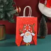 Bolsa de regalo de Santa Claus de dibujos animados para fiesta navideña infantil Bolsa tote para dulces bolsa de papel de embalaje con estampado de moda venta al por mayor