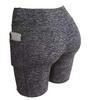 Pantalones cortos deportivos de yoga para mujer de Amazon, europeos y americanos, con bolsillos laterales, leggings ajustados para levantar la cadera y la cintura.