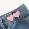 Botón con forma de corazón para ceñir la cintura, una herramienta mágica para ajustar el tamaño de la cintura de faldas y pantalones, un botón decorativo para apretar y fijar