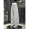 Calça de moletom larga estilo americano de corte justo para homens, calça esportiva casual de academia de alta qualidade para outono, calças compridas largas de perna curva soltas