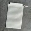 Pantalones con Bolsillo de Solapa con Cordón de Tela No Tejida Ropa Juguetes Bolsa de Almacenamiento a Prueba de Polvo Bolsa en Blanco para Embalaje de Zapatos Impresa con logo