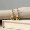 Brincos de Olho de Tigre com Recortes Espiralados Super Brilhantes Novo Estilo Chinês Feminino Luxo Leve Nicho Estilo Corte de Corte Brincos Pendentes Estilo Antigo Brincos de Clipe de Orelha