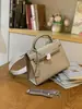 Bolso Kelly con Correa Ancha para el Hombro Bolso de Mujer Bolso de Mano de Alta Gama 2026 Nuevo Estilo Bolso de Hombro Elegante Bolso Cruzado de Moda Versátil